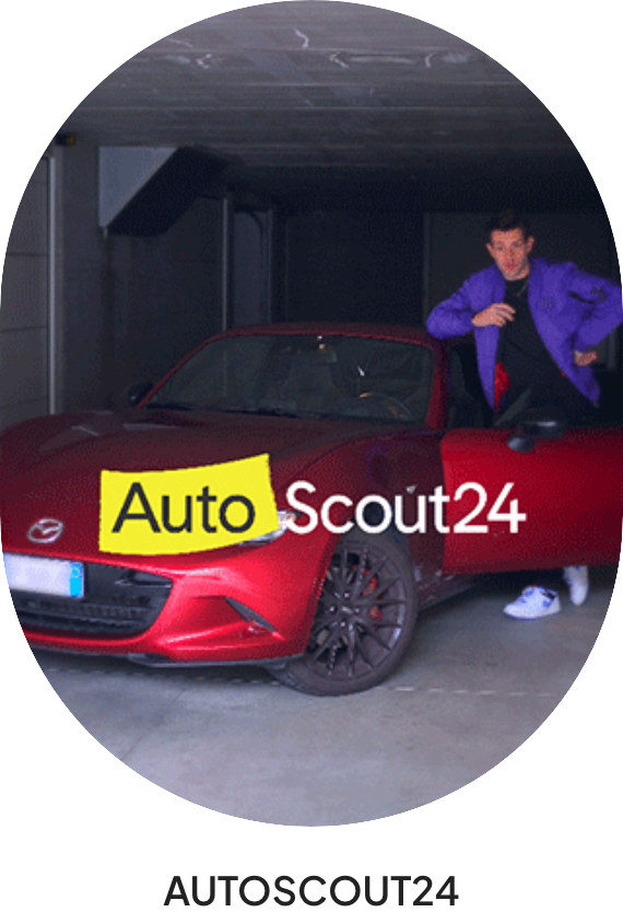 Oval photo from a 40Degrees campaign: a creator in a purple jacket steps out of a red sports car in a garage, with the AutoScout24 logo over the image and the caption AUTOSCOUT24